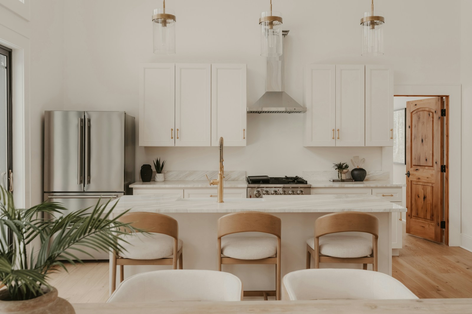 Bright white kitchen reference with neutral materials and modern styling